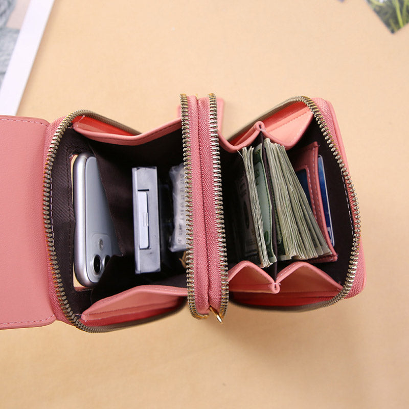 Anti-theft leather crossbody bag in pink, open front pocket with card and cash slots.