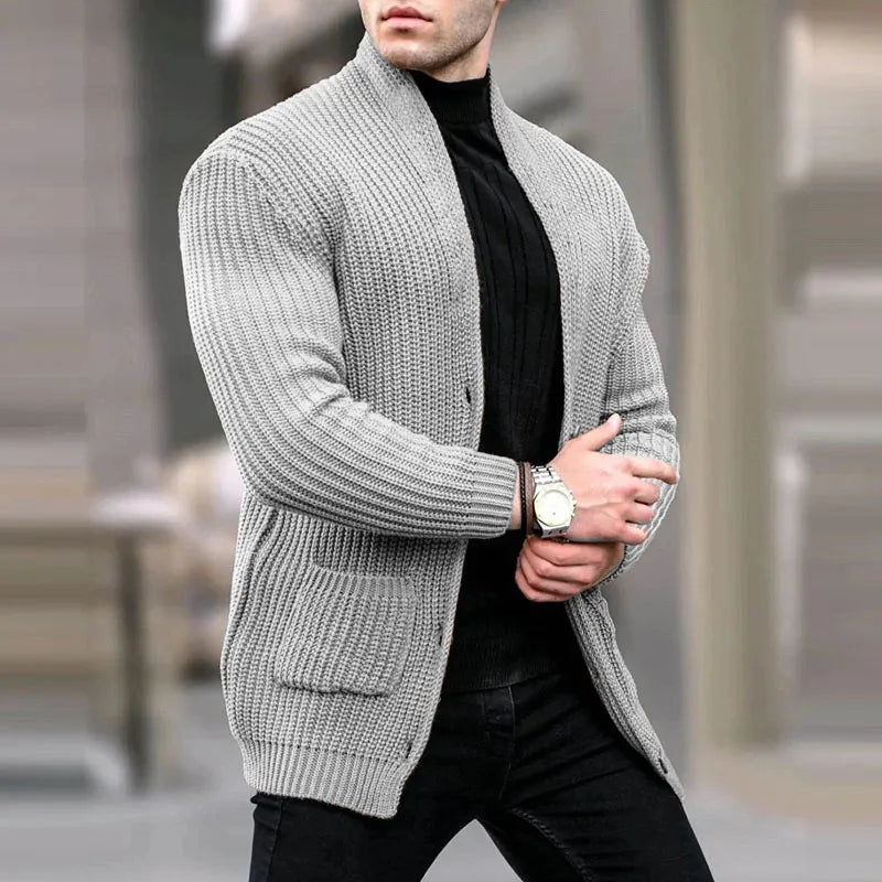 Light gray knit cardigan with button front, ribbed cuffs, and patch pockets
