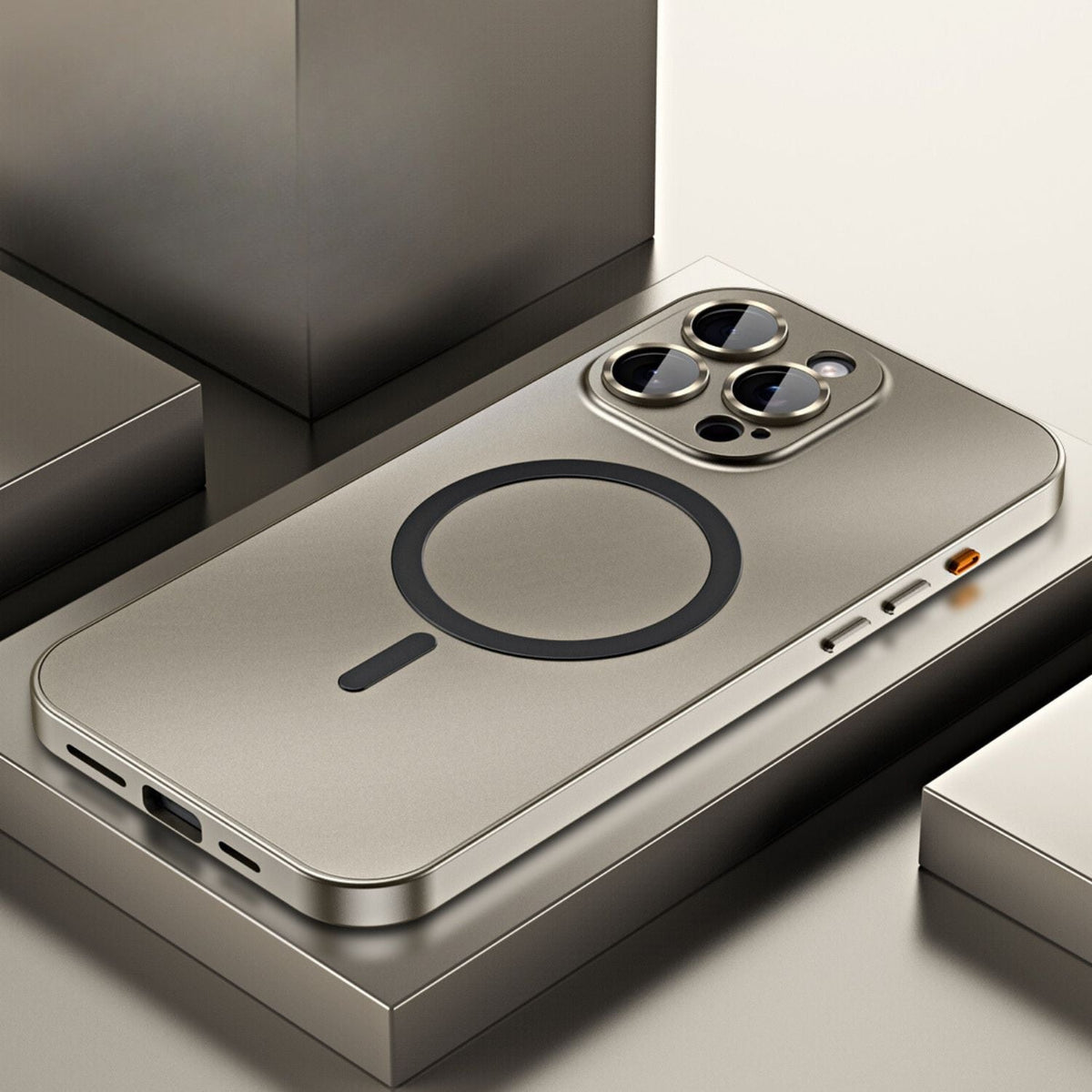 Metal iPhone case in silver with magnetic ring, bottom slots, and camera cutouts