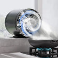 Black cylindrical kitchen exhaust fan with front fan grille and spinning blades