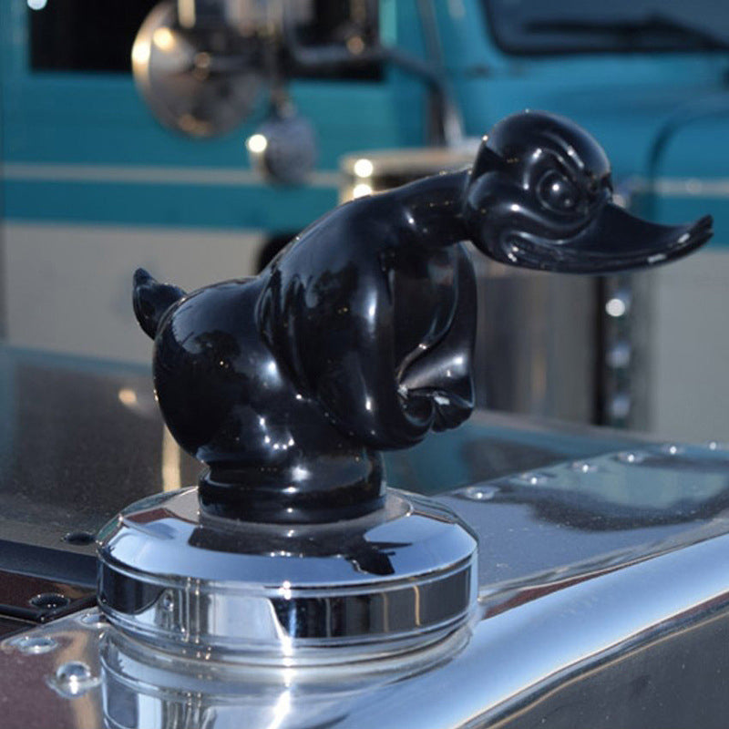 Black duck hood ornament with glossy finish on round chrome base