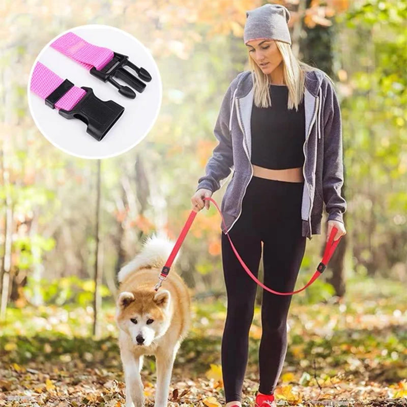 Woman walking a dog with a red leash, inset showing pink and black clip mechanism.