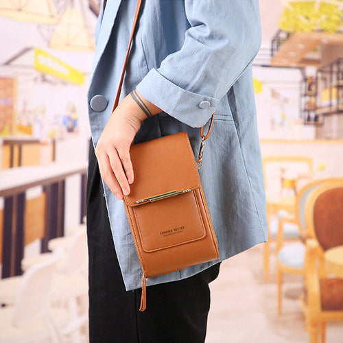 Anti-theft leather crossbody bag in brown, worn on shoulder with front flap.