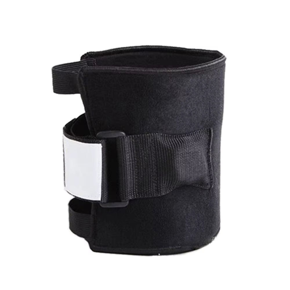 Black fabric brace with central white pad and wide Velcro strap close-up
