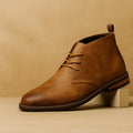 Classic hand-stitched chukka boots, caramel color front view