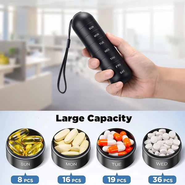 Black aluminum weekly pill organizer in hand with wrist strap and labeled day sections