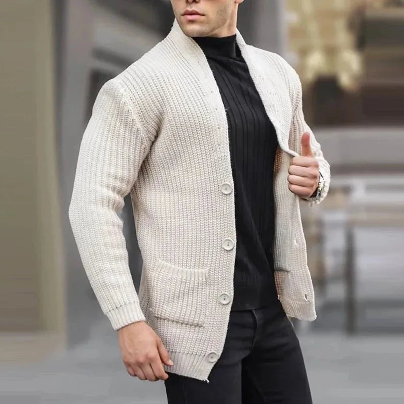 White knit cardigan with button front, ribbed hem and cuffs, and patch pockets