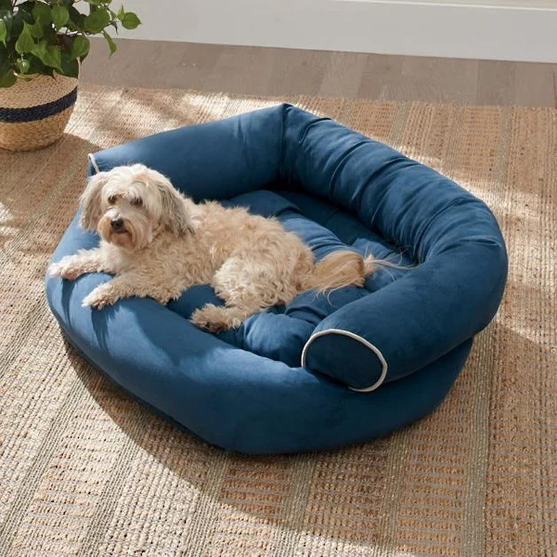Bolster dog bed with rolled sides, blue fabric with circular bolster edges
