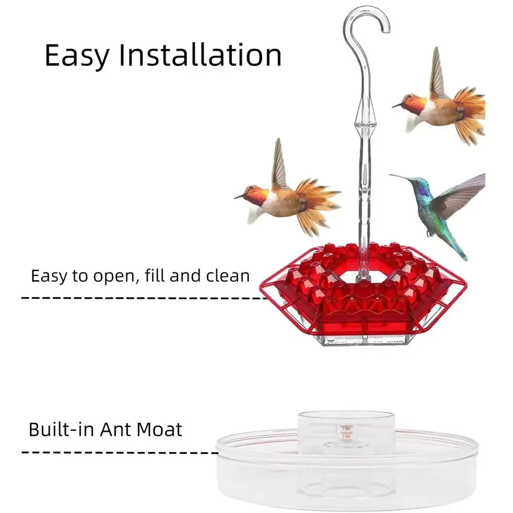 Red ant-proof hanging bird feeder with clear tube and built-in ant moat base.