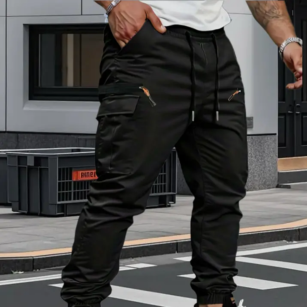 Black tapered cargo pants with drawstring waist, cargo side pockets, elastic cuffs