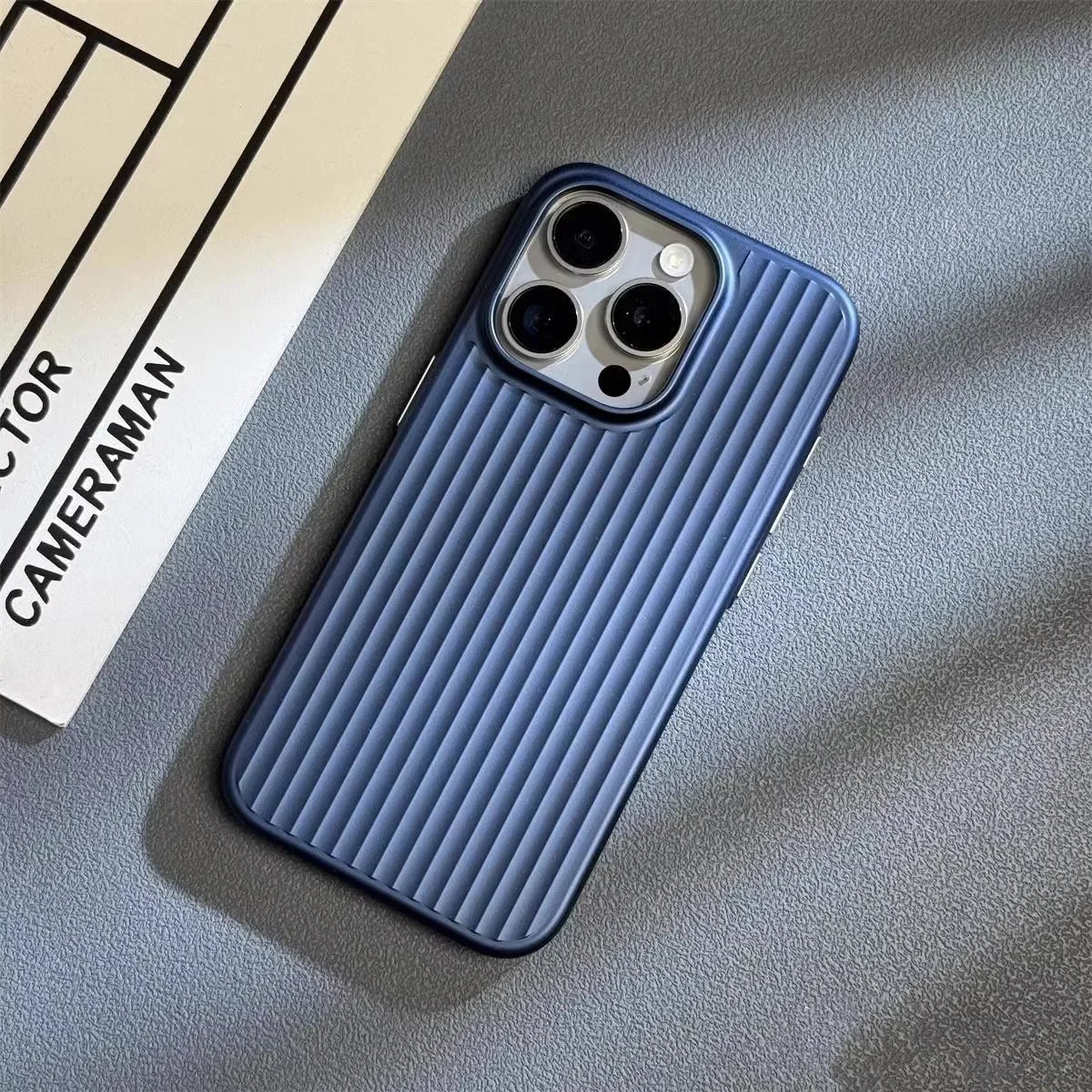 Blue iPhone case with vertical ridged pattern and triple camera cutouts