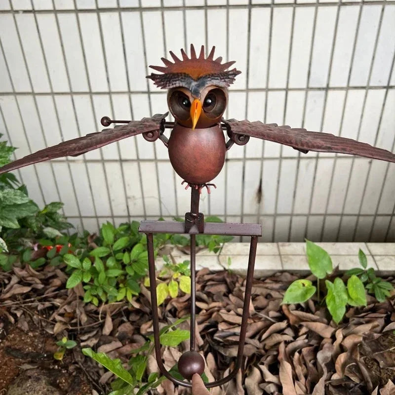 Wind-powered owl garden stake, brown owl with spiked head and wide wing panels