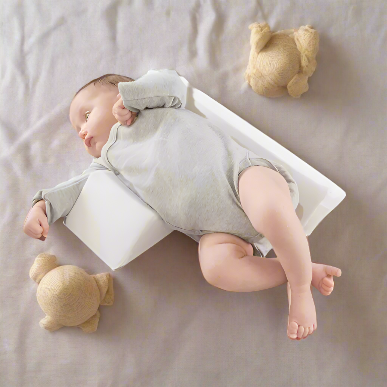 Baby lying on a white blanket with teddy bears around