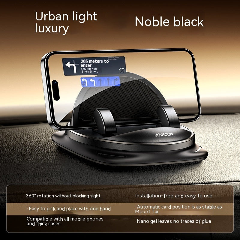 Black silicone car phone mount with circular base and textured cradle