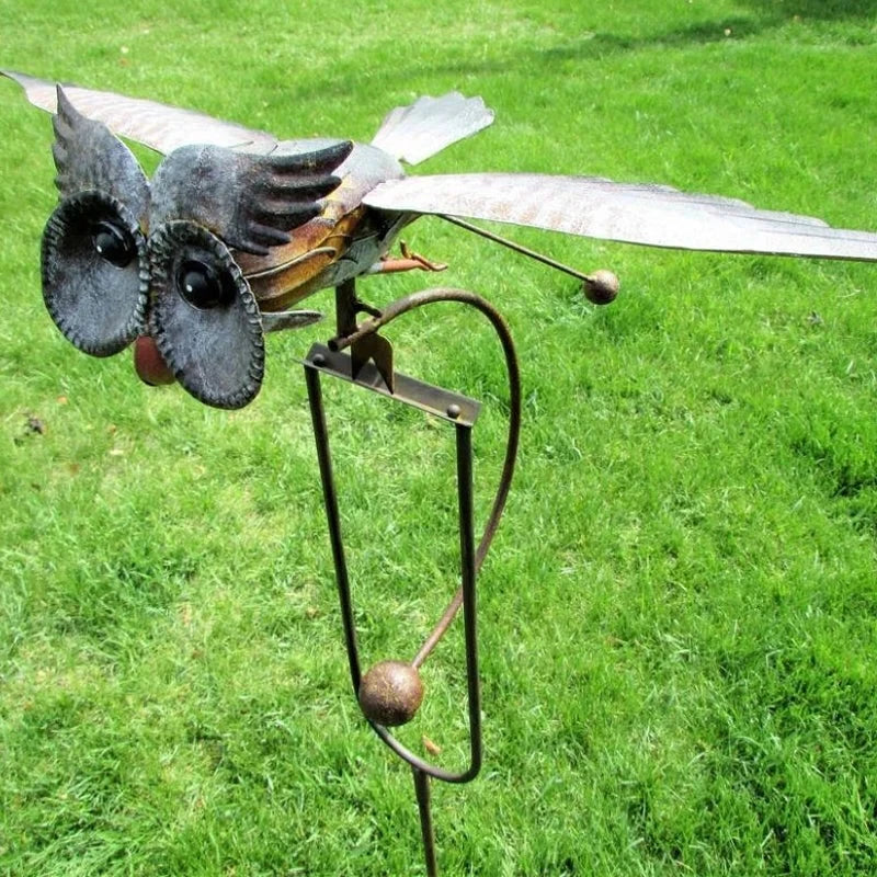 Wind-powered owl garden stake, gray metal owl with wide wings and curved support