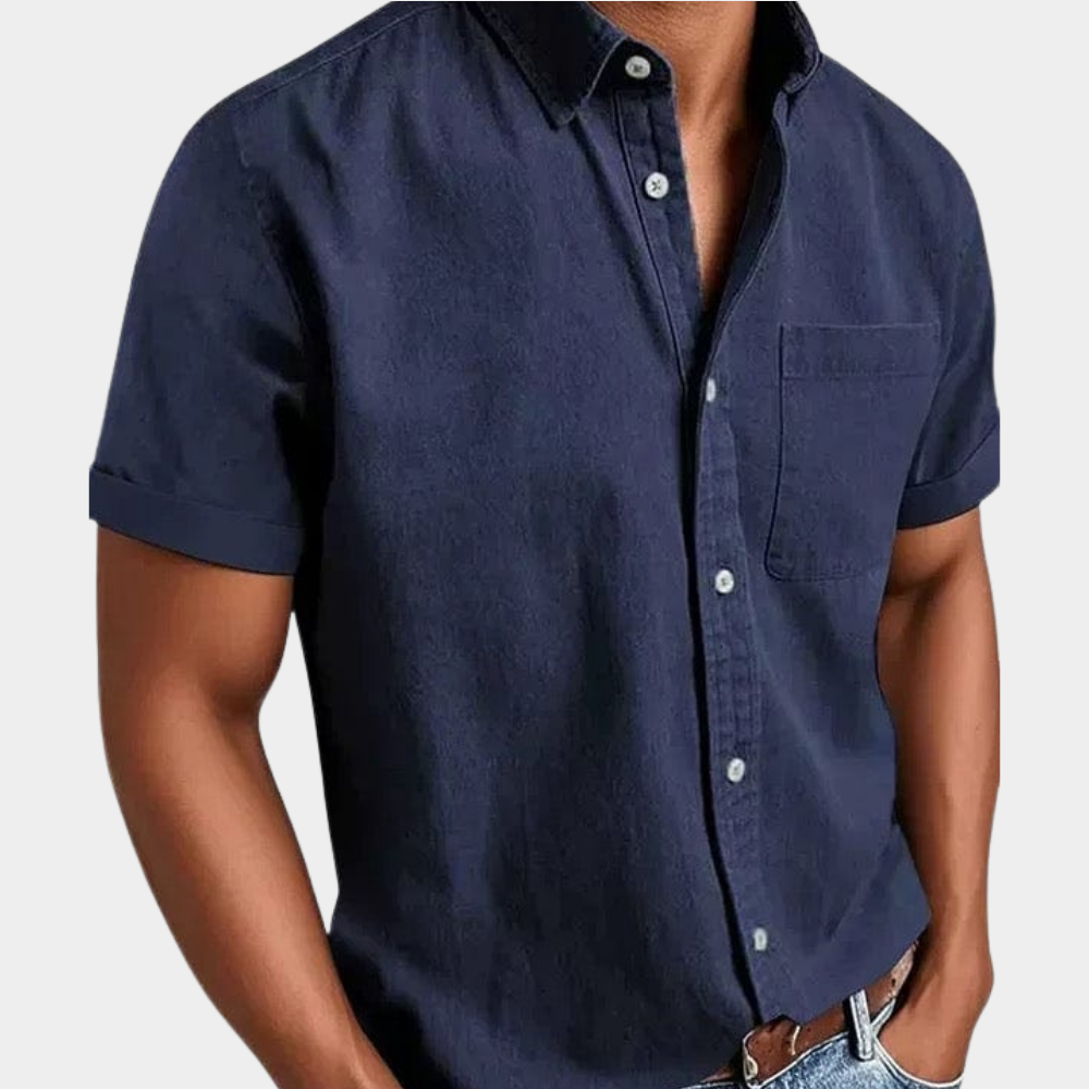 Men's short-sleeve button-up shirt in navy blue with chest pocket and button front