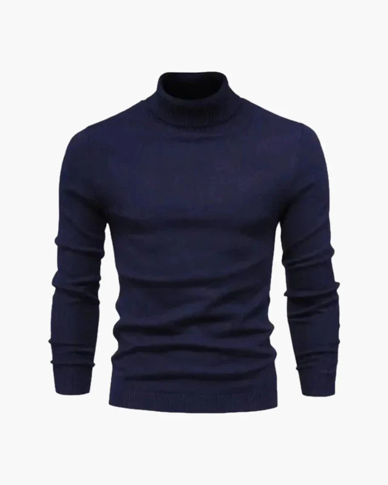 Navy ribbed turtleneck knit sweater with long sleeves and ribbed cuffs.
