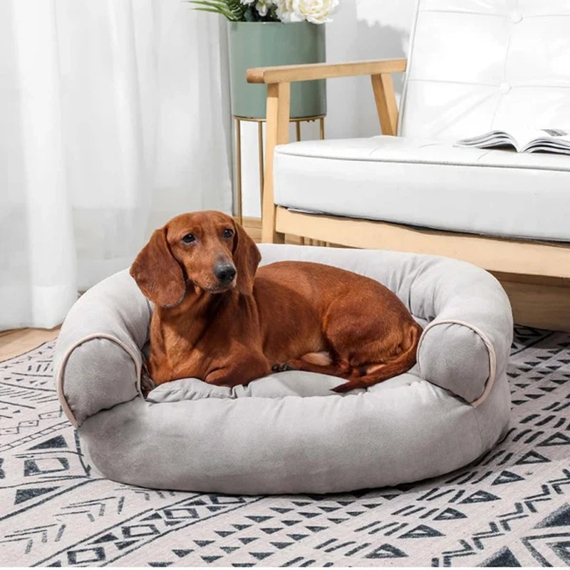 Bolster dog bed with rolled sides, light gray fabric and rounded front openings