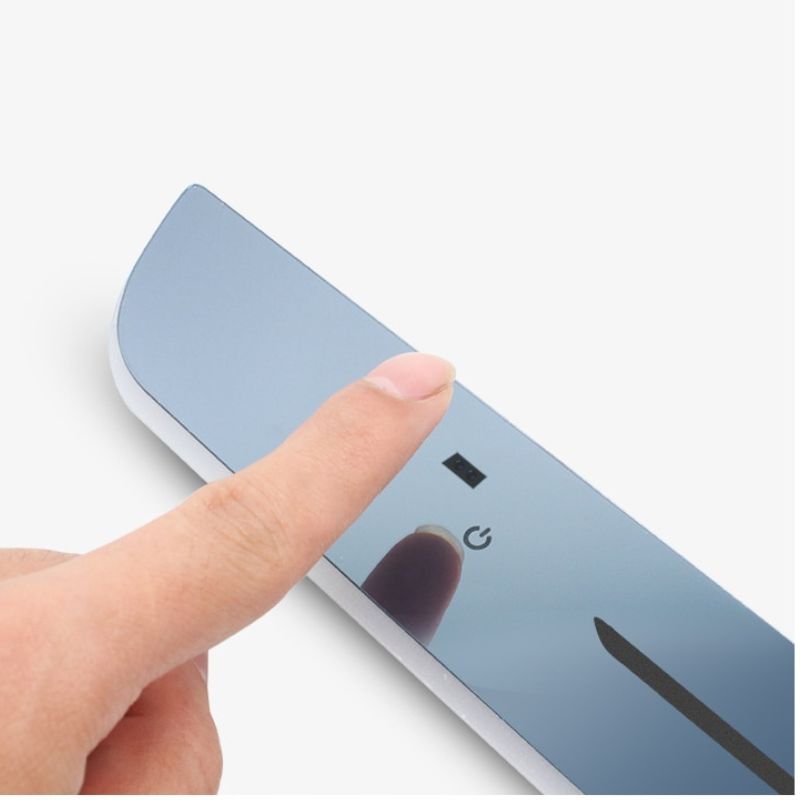 Magnetic LED door light bar with control button, shown being pressed