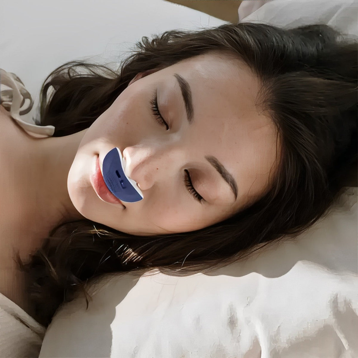 Portable anti-snoring device worn on nose with mint and red nasal attachments