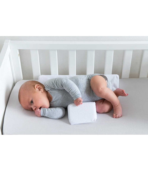 Adjustable baby side sleeper pillow with grey center and white wedge cushions