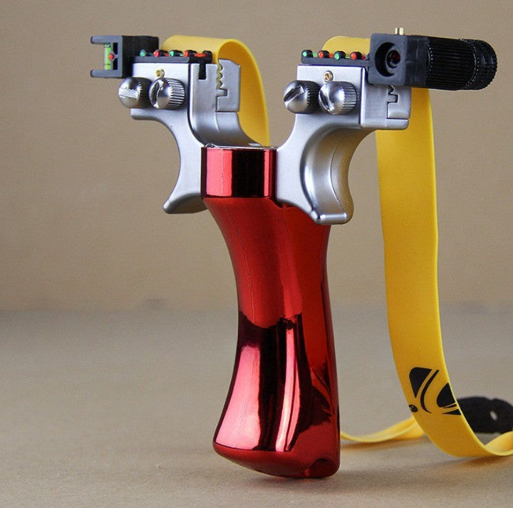 Red laser slingshot with chrome silver frame, yellow band, black barrel