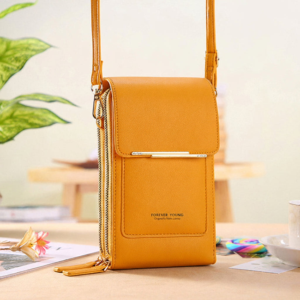 Anti-theft leather crossbody bag in yellow, with front flap and chain shoulder strap.