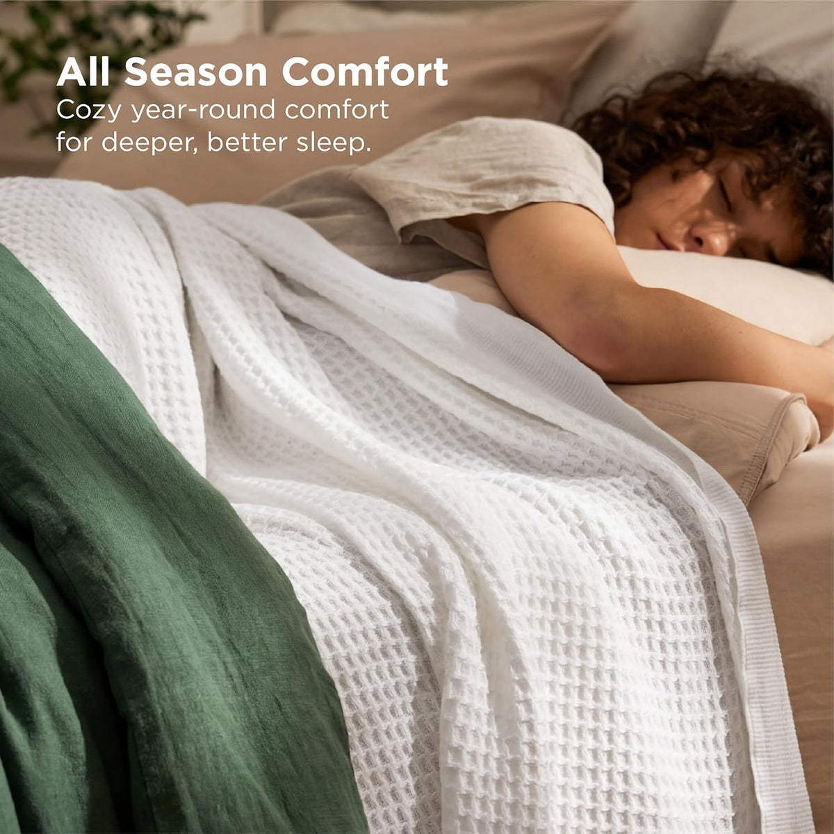Cotton waffle-weave cooling blanket in white, draped over a bed