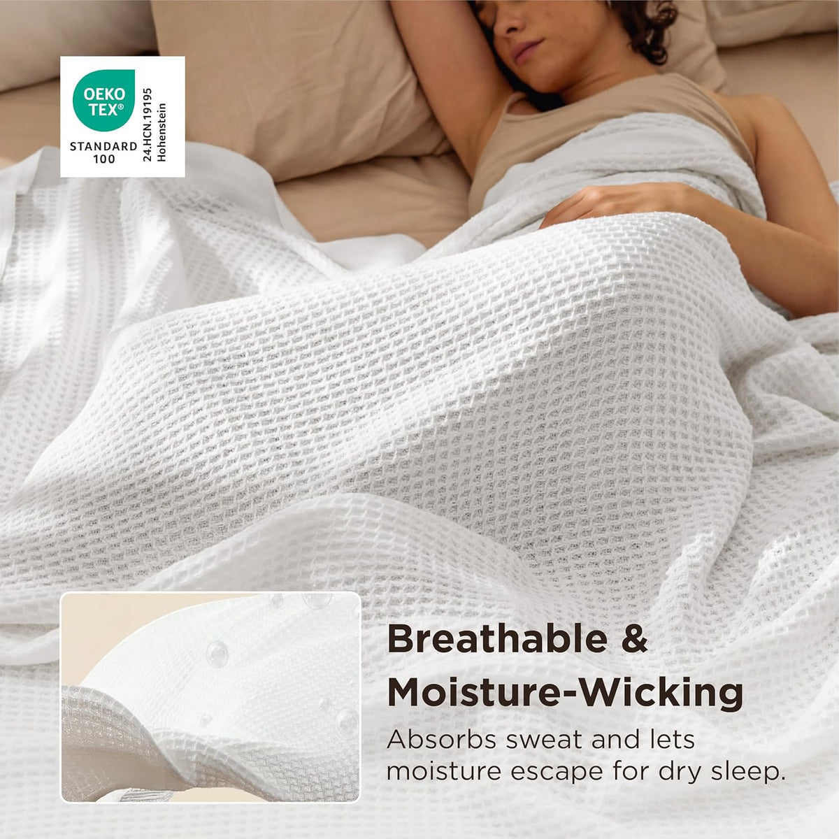 White cotton waffle-weave cooling blanket covering a person on a bed.