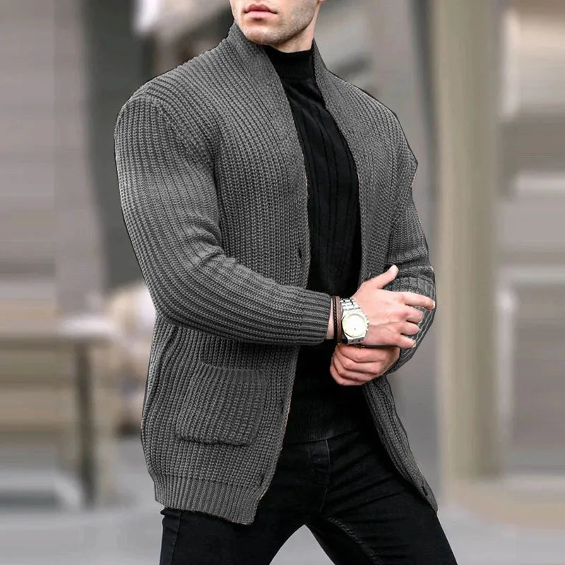 Dark gray knit cardigan with button front, ribbed cuffs, and patch pockets