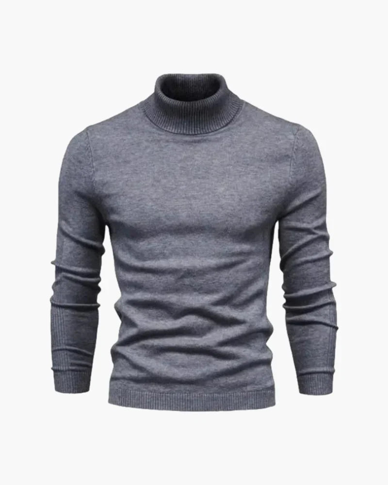Gray ribbed turtleneck knit sweater with long sleeves and ribbed neckline.