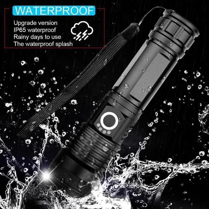 Waterproof black flashlight with sealed body and water-splash droplets around it