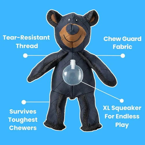 Navy bear plush chew toy with tan muzzle and visible squeaker bulge.