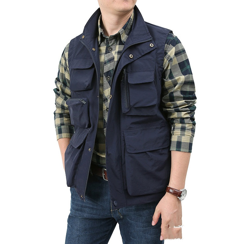 Navy utility vest with multiple flap pockets, snap front, and sleeveless outdoor fit