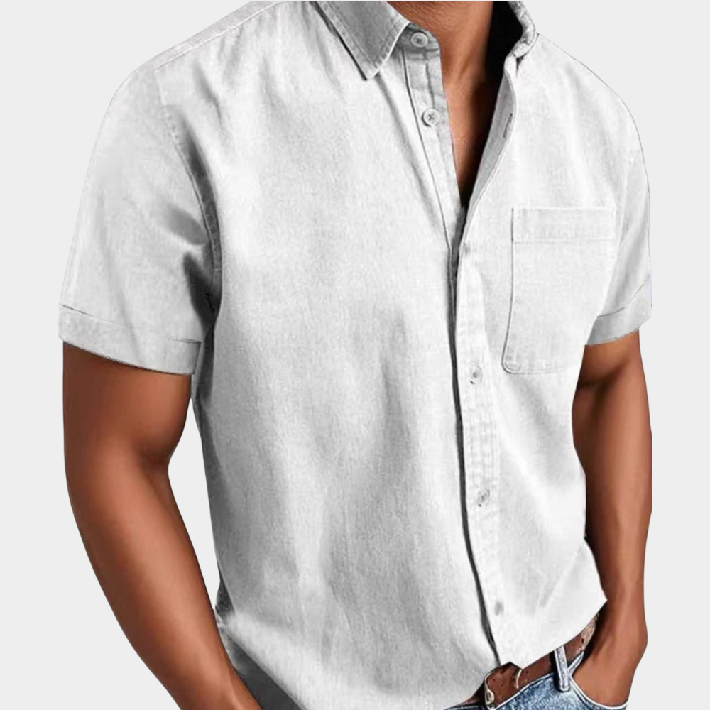 Men's short-sleeve button-up shirt in white with chest pocket and button front