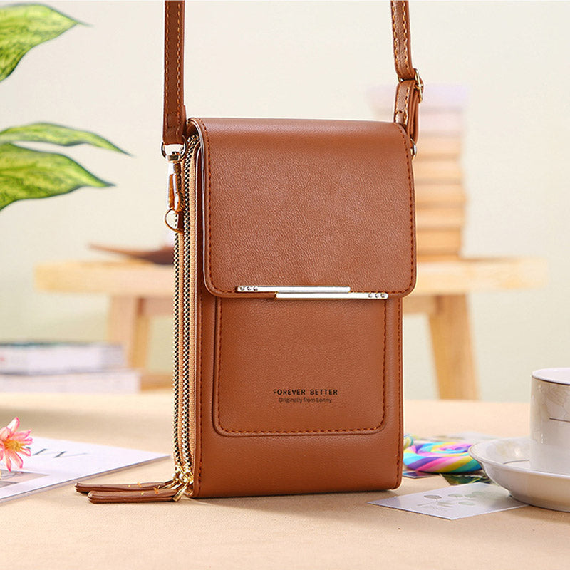 Brown leather crossbody bag with front flap and adjustable shoulder strap, chain pull