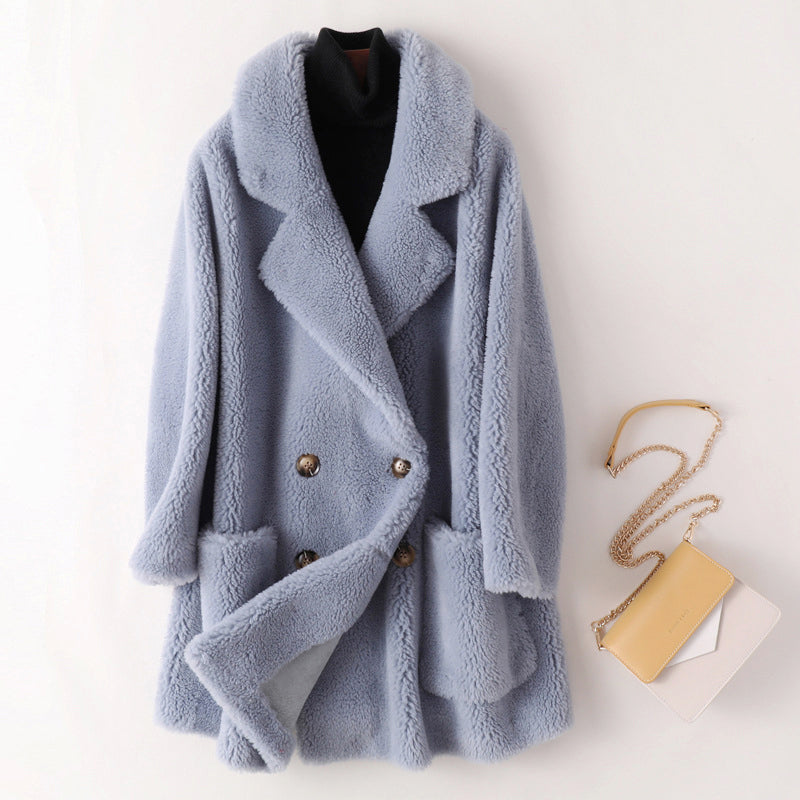 Plush double-breasted coat in light blue with notched lapels and gold-tone buttons