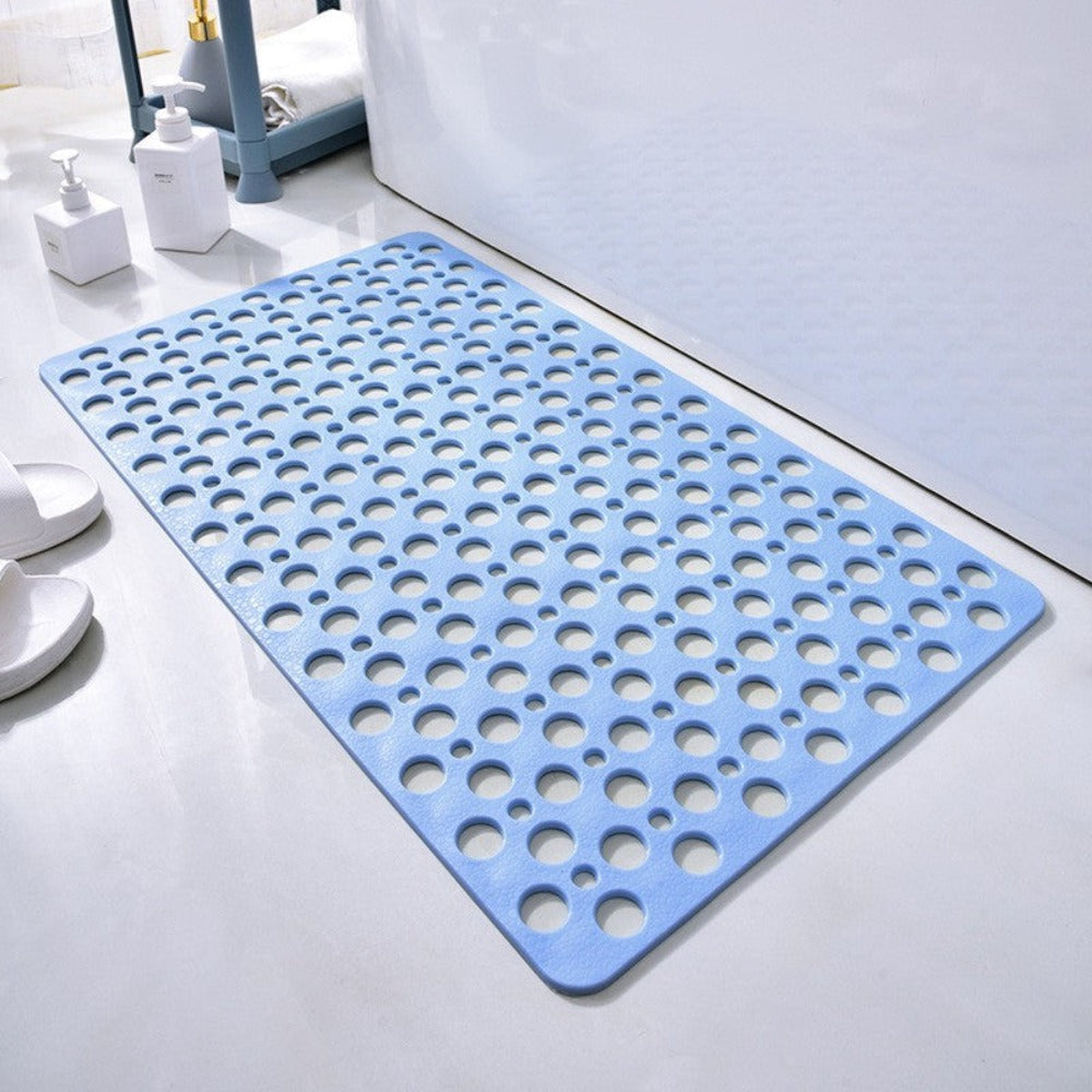 Blue non-slip shower mat with round drainage holes for slip-resistant footing