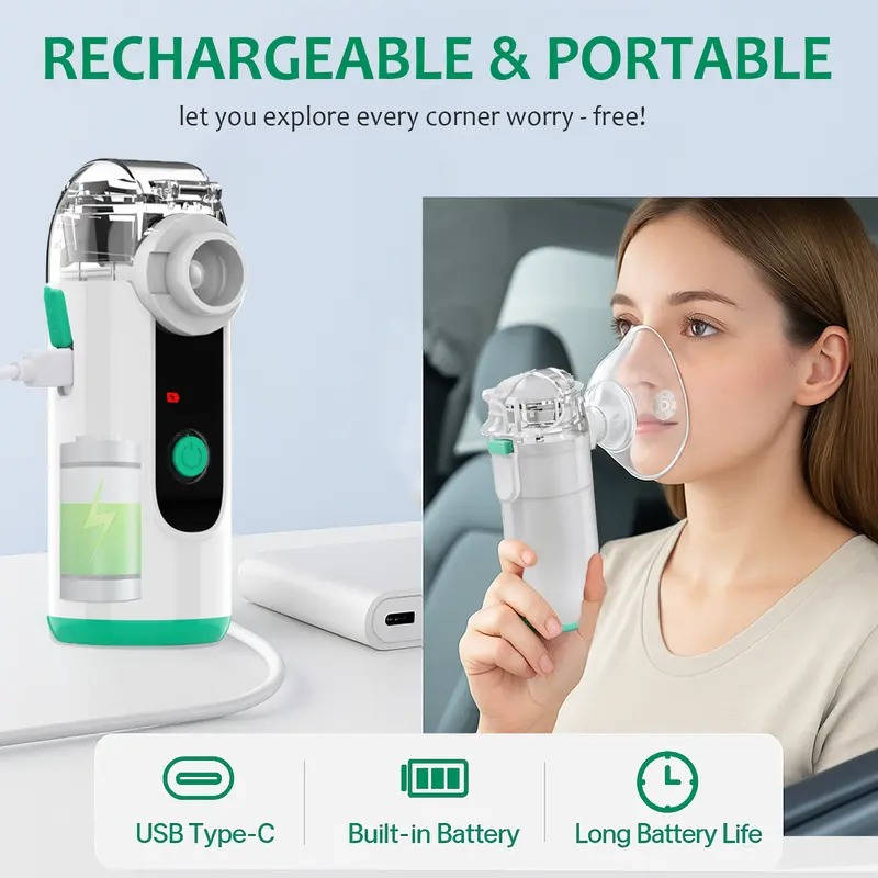 Portable white mist inhaler with clear mask held near face, green battery band