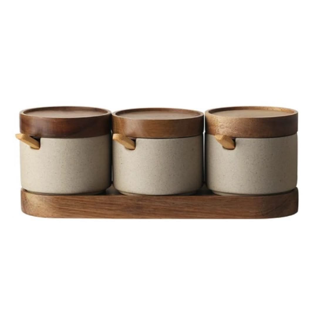 Ceramic condiment storage jars set of 3 with beige bodies, wood lids, and a wooden tray