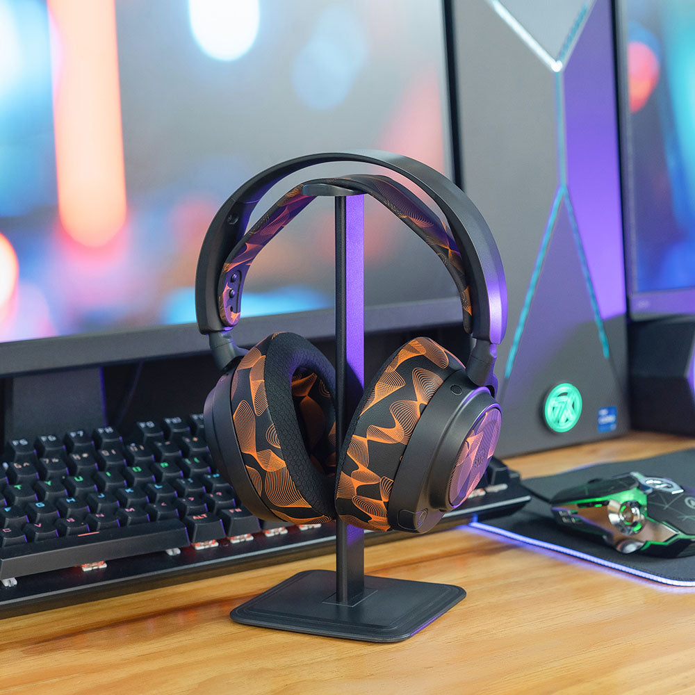Over-ear headset with black cooling gel replacement earpads featuring orange accents