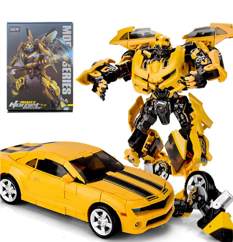 Yellow transformer robot toy with detailed arms and black vehicle attachment