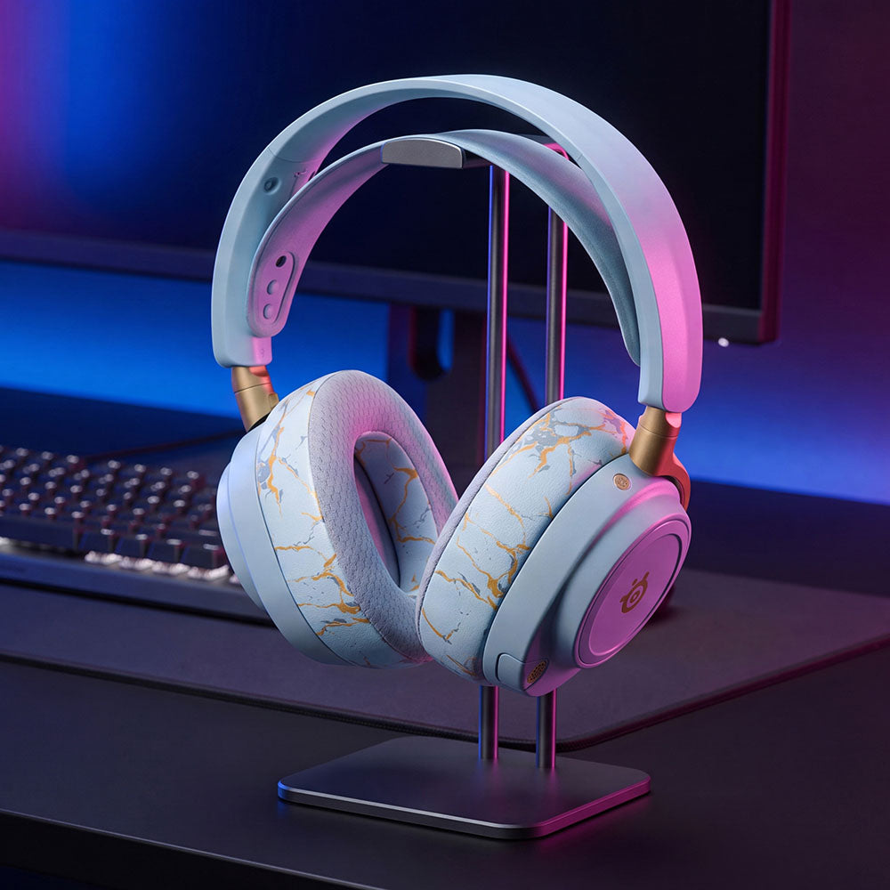 White patterned replacement earpads installed on over-ear headphones, with gray inner padding