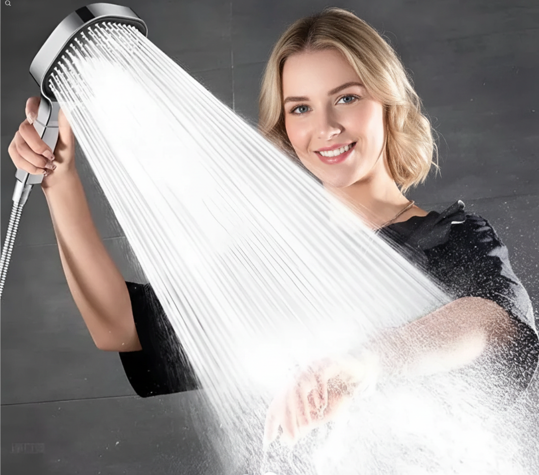 Handheld high-pressure turbo boost shower head with silver face and strong white water spray