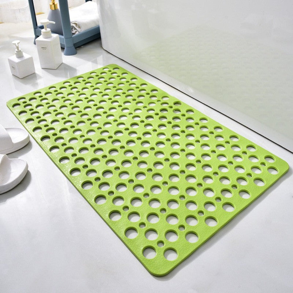 Green non-slip shower mat with round drainage holes and textured surface