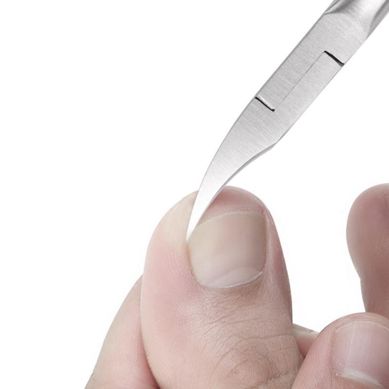 Stainless steel toenail scissors close-up of sharp curved blade and hinge