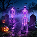 Solar skeleton stake lights with purple LED glow, two glowing skeleton figures on stakes