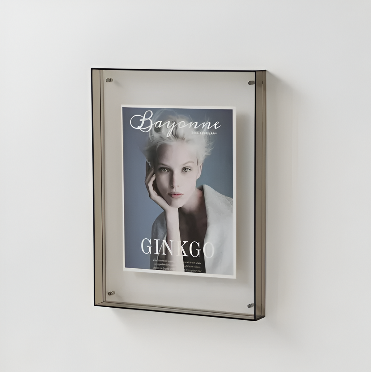 Grey floating photo frame with clear acrylic front and monochrome portrait photo