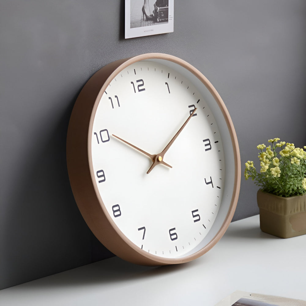 Angled cream-rim wall clock with white face, gold hands, and black numerals