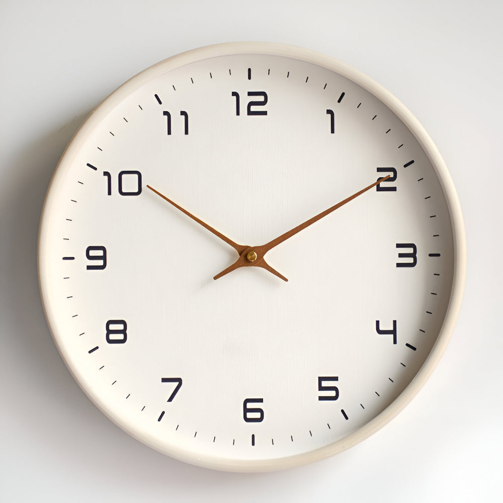 Cream rim wall clock with white face, black numerals, and gold hands